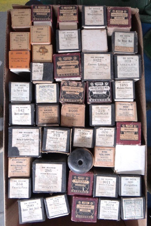 Player Piano Rolls: Collection of various early player piano rolls.
