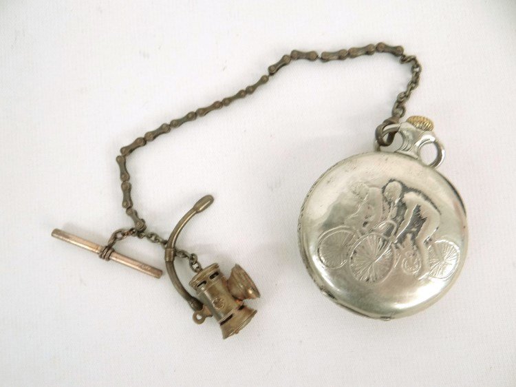 Breguet 8 Day Pocket Watch: Breguet 8 day pocket watch with safety riders on case. Porcelain dial, manual wind. Not working. Fair condition. Has search light and handlebar fob. Pedaling History Museum.