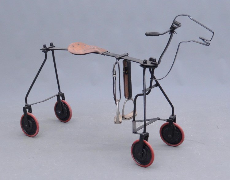 Horse Form Four Wheeled Tricycle: Vintage horse form four wheeled tricycle. Steering action. Restored. 33 Ht., 46" length. David Metz Museum."