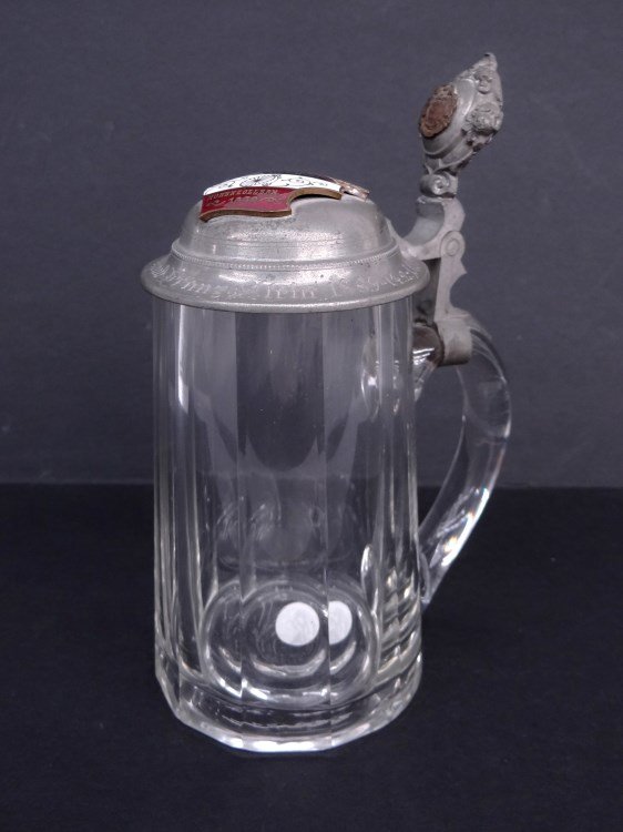 Stein: Glass stein with the club badge of the Berliner Radfahrer Club Hohenzollern" mounted on the lid and a bronze "Deutscher Radfahrer Bund" logo on the thumb lift . 7 ½" Ht. Good condition."