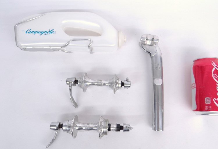 Campagnolo Lot: Boxed Campagnolo parts including C. 1980's Aero 26.8 stem, 126 mm NOS front and rear hubs (Record), waterbottle. Good condition.