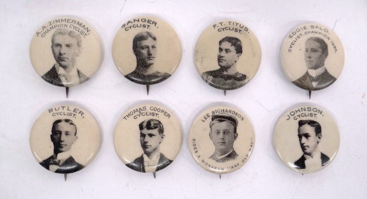 Bicycle Racer Buttons: Lot of five various bicycle racer buttons including Zimmerman, Thomas Cooper, Johnson" etc. Fair to good condition."
