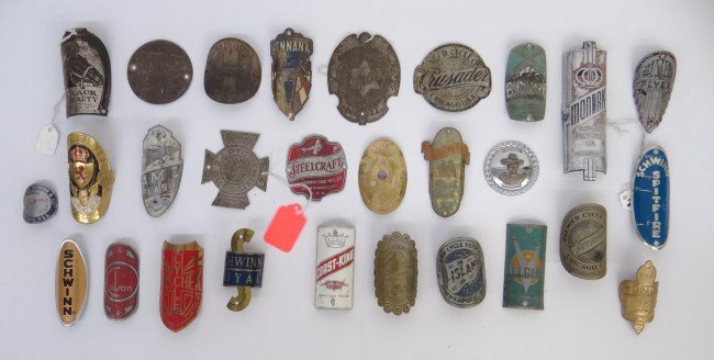 Bicycle Headbadges: Collection of 28 bicycle headbadges including Mead, Pennant, New World, Island, Monark, Black Beauty, Western Flyer. Schwinn etc., fair to good condition. Pedaling History Museum.
