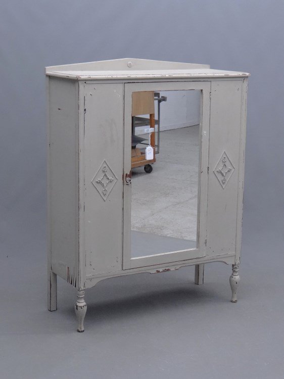 Armoire: C. 1920's armoire with mirrored door in white paint. As found. 42" x 16 3/4" x 54".