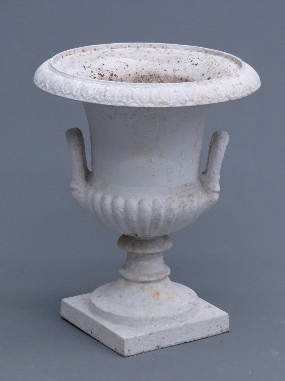 Cast Iron Urn: Cast iron urn with side handes. 15" diameter, 20" Ht.
