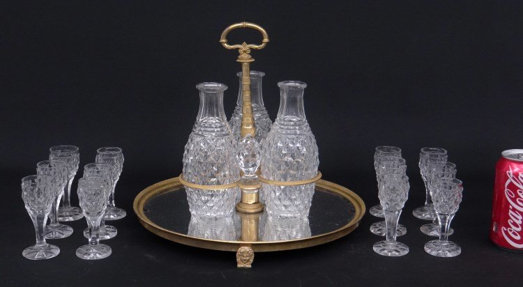 19th c. French Brandy Set: 19th c. French ormolu and glass brandy set including three decanters with stoppers and 12 cordials. 3 cups have slight chips and two stoppers have small dings on top!