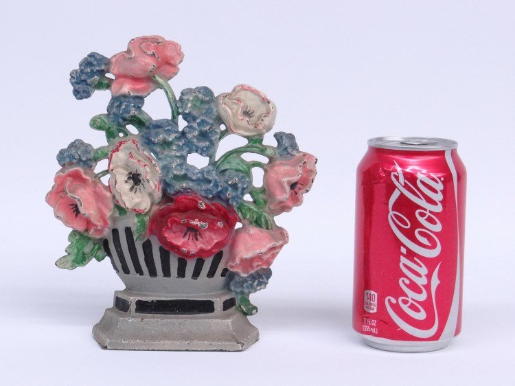 Doorstop: Painted Hubley flower basket doorstop. 7 1/2" Ht.