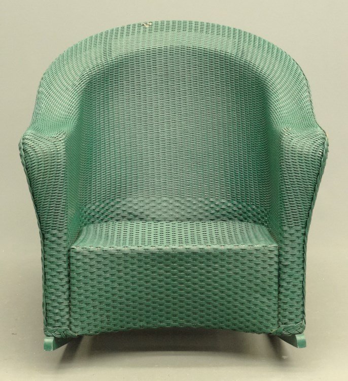 Lloyd Loom Rocking Chair: Labeled Lloyd Loom wicker rocking chair with cushions. 15" seat Ht., 32" overall Ht.