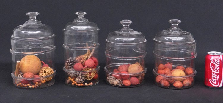Glass Jars: Lot of four glass apothecary jars.