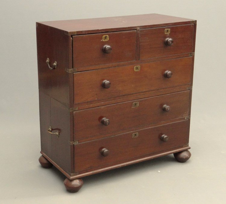 Mahogany Campaign Chest Of Drawers: Two part mahogany British Colonial style campaign chest of drawers with side handles and bun feet. 36" x 18" x 39".