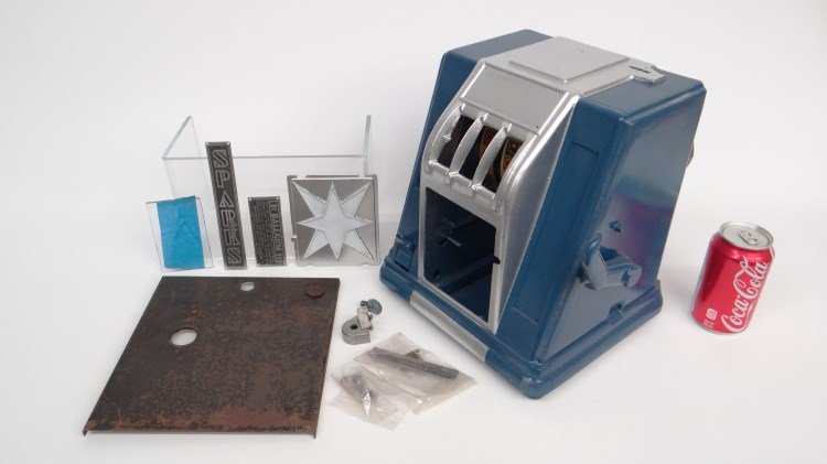 Slot Machine: Vintage "as found" slot machine with various parts.
