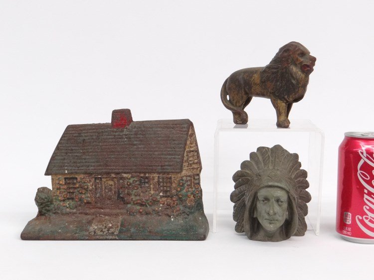 Misc. Lot: Misc. lot including painted house doorstop, lion still bank, cast metal Native American head.