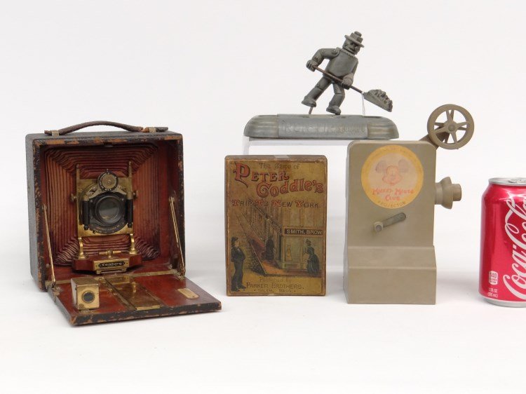 Misc. Lot: Misc. lot including vintage "Iron Fireman" ashtray, "Century" camera, Mickey Mouse Club projector and "The Game of Peter Coddle's" game.