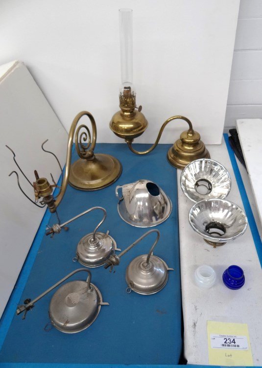 Lighting Lot: Lot including reflector shades, (3) night lamps (one marked "The Little Beauty..", two shades and two brass weighted oil lamps.