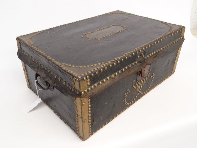 19th c. Trunk: 19th c. tack decorated trunk with side handles and wallpaper interior. 22" x 14 1/2" x 9 1/2" Ht.