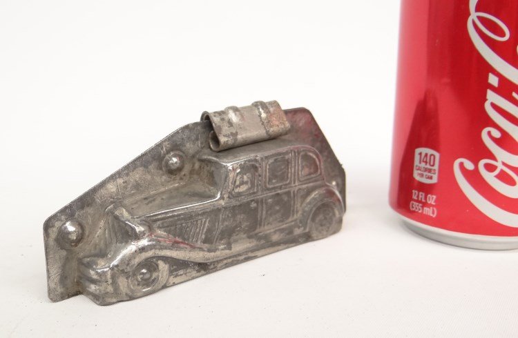 Metal Chocolate Mold: Metal chocolate mold of a car marked "Cluydts Antwerp". 5 1/2" x 2" Ht..