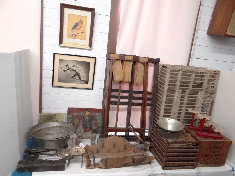 Primitive Lot: Misc. primitive lot including: egg boxes, star candlesticks, wallpaper print press, shoemakers tool, tin ware, wall rack with wrought hooks, bird cage, corn planters, runner print, frames and more.