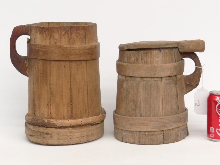 Woodenware Lot: Lot two staved tankards (one with lid). 9 1/2" and 12" Ht., one as found.