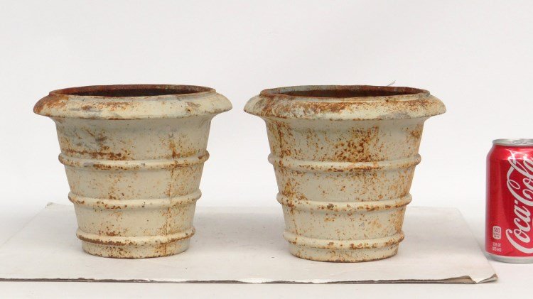 Cast Iron Pots: A pair of cast iron plant pots in white paint. 8 1/2" x 7" Ht..