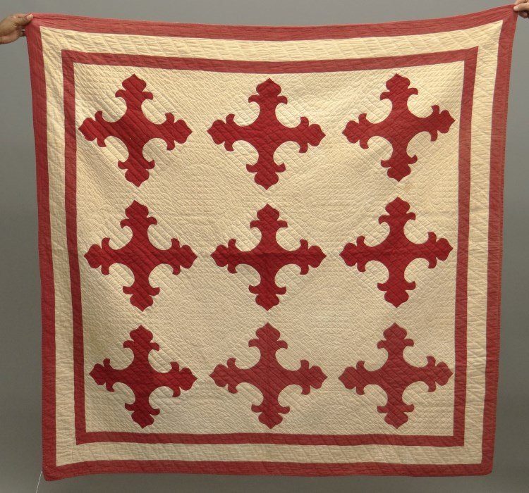 Quilt: 19th c. red and white applique quilt. 68" x 77". Has label with info including "Owner Betsy Riley-Hudson N.Y. June 1994". Staining.