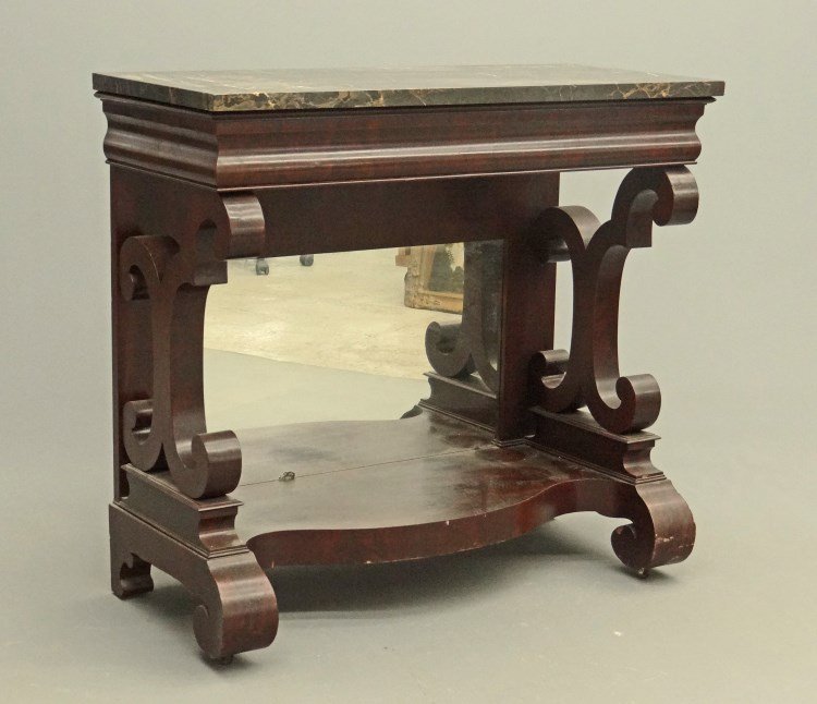 19th c. Empire Marble Top Pier Table: 19th c. Empire mahogany Egyptian marble mirrored back pier table with rolled columns and rolled feet. 42" x 18 1/2" x 38" Ht. Provenance: Redwood New York Estate.