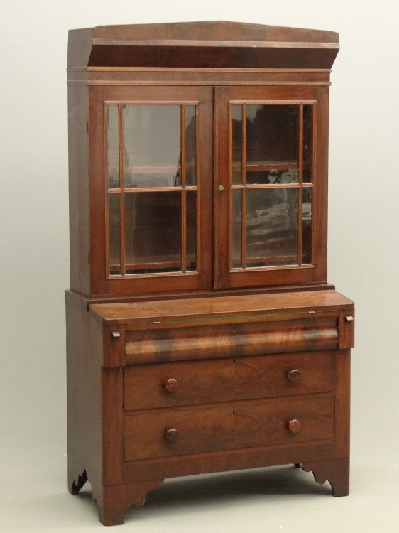 19th c. Empire Secretary: 19th c. two part mahogany Empire secretary top having two reeded paned doors over three drawers with desk section. 39 1/2" x 18 1/2" x 69 1/4" Ht. Provenance: Redwood New York Estate.