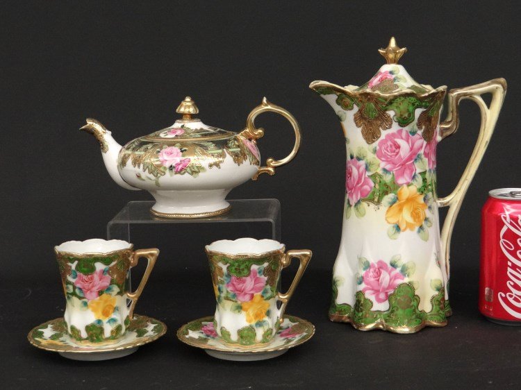 Nippon Tea Set: Nippon four piece tea set. Teapots 4" and 11" Ht. Provenance: Redwood New York Estate.