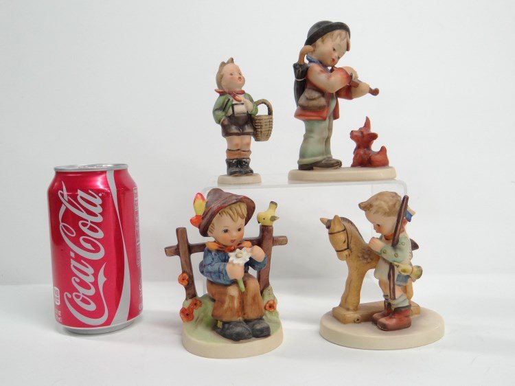 Hummel Lot: Lot of four Hummels including boy with violin, She Loves Me...", Prayer Before Battle, boy with basket. Provenance: Redwood New York Estate.