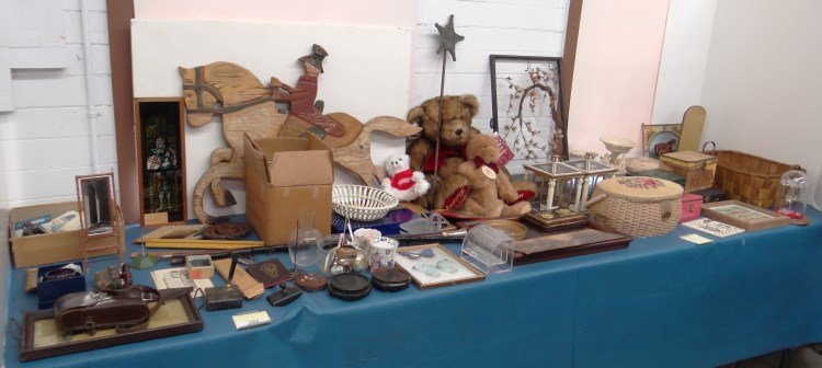 Misc. Lot: Misc. table lot including G.A.R. ornament, stain glass, Asian sculpture, MOP binoculars, sewing items, early multicolor basket etc. Provenance: Redwood New York Estate.
