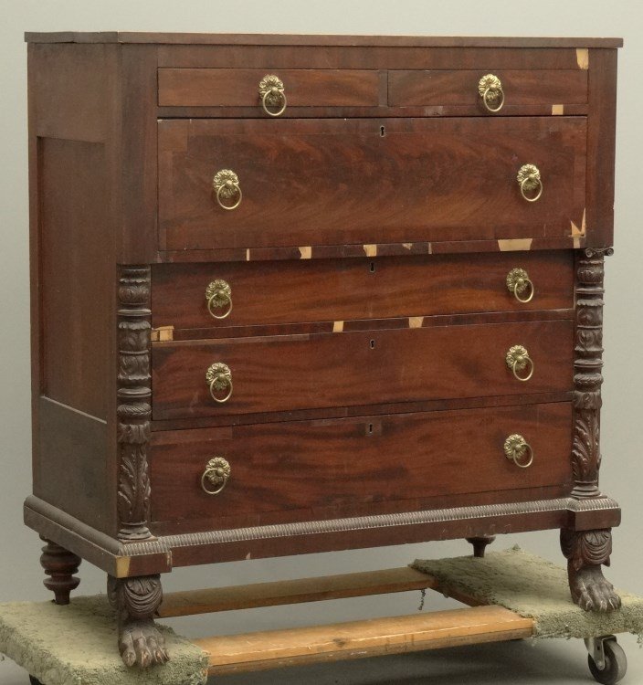 19th c. Empire Server: 19th c. Empire mahogany six drawer server with carved columns and paw feet. Veneer loss. 47" x 22" x 50" Ht. Provenance: Redwood New York Estate.
