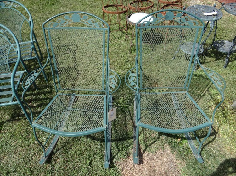 Wrought Iron Rocking Chairs: Pair of wrought iron patio rocking chairs.