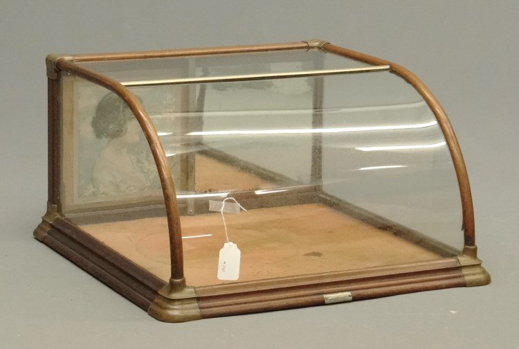 Counter Top Showcase: C. 1900's counter top showcase labeled "Farley & Hofman Rochester N.Y.". 28" x 27" x 15" Ht.