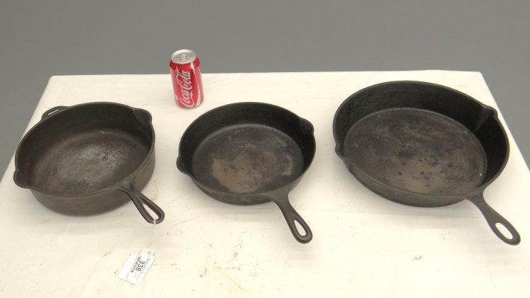 Cast Iron Cooking Pans Including Wagner: Lot three cast iron skillets, one marked "Wagner".