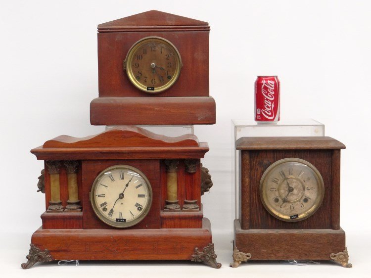 Clock Lot: Lot (3) clocks including: Seth Thomas grain painted mantle clock, New Haven oak case clock with metal feet and Seth Thomas peaked top clock.