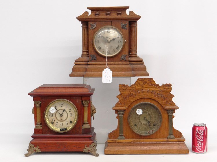 Clock Lot: Lot including: Ingraham oak Victorian shelf clock, Seth Thomas faux grain decorated shelf clock with cast feet, Seth Thomas oak Victorian shelf clock.