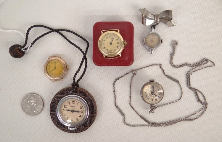 Watch Lot: Lot five watches including 14 Karat gold Bulova watch pin, Ingersoll Lapell watch, ball watch, Wadsworth 10 karat gold watch, 14 karat gold watch in orig. case.