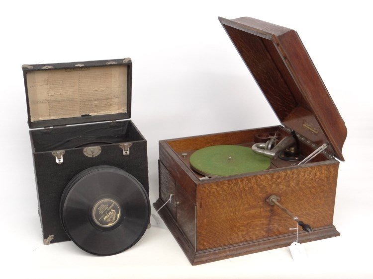 Oak Case Victrola: C. 1900's oak case Victrola with records in case.
