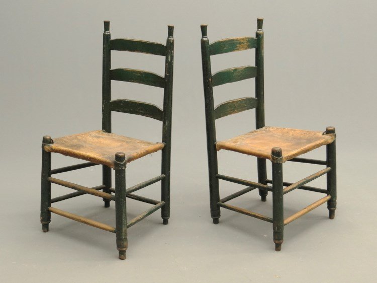 Pair 19th c. Chairs: Pair 19th c. ladderback chairs in green paint with hide covered seats. 18" seat Ht., 35" overall Ht. Deaccessioned from the American Folk Art Museum New York City.