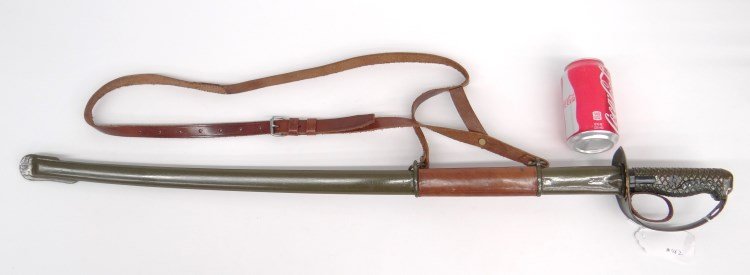 Replica Sword: Replica Military cavalry style sword, curved steel blade, metal grip, metal scabbard, leather belt. 38" L.