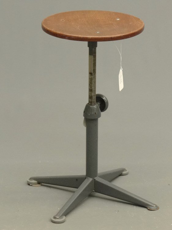 Industrial Stool: Industrial stool with adjustable seat height. 13 1/4 Dia..