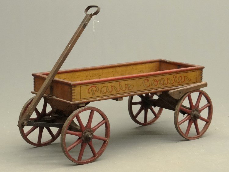 "Paris Coaster" Child's Wagon: C. 1900's child's "Paris Coaster" wagon in original paint surface. Wooden wagon wheels. 40"x 13" x 14" Ht. (without handle).