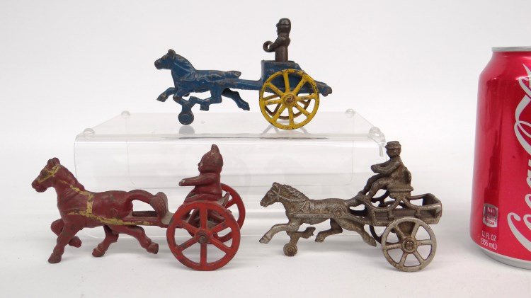 Cast Iron Toy Lot: Lot of (3) cast iron toys. Palmer Cox "Brownie" mfg. by Wilkins Co. Hubley Co., Chariot and horse drawn road cart. Ranging from 4 1/8" L. to 2 1/2" W.