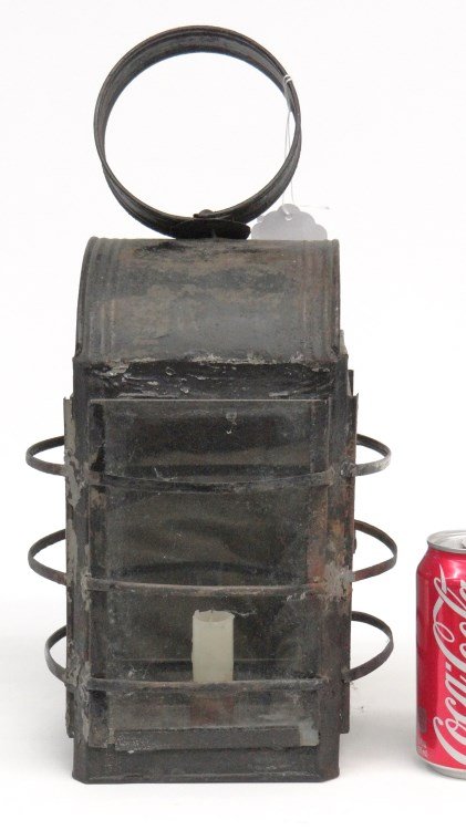 Lantern: Early tin and glass hanging cage lantern. Old black paint. 16 1/2" Ht. Provenance Dr. Jamie Turndorf Millbrook New York.