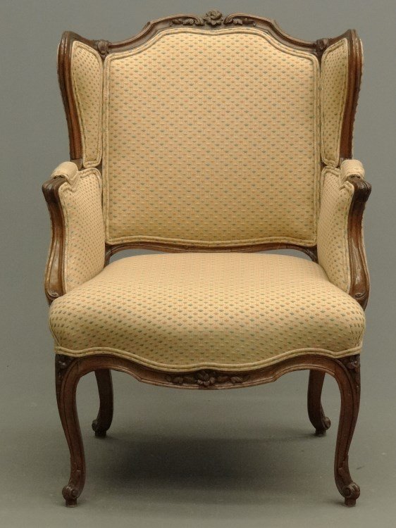 French Bergere Chair: French upholstered and carved wood Bergere chair. 18" seat Ht., 38" overall Ht.