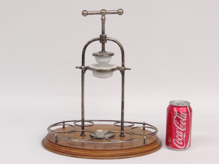 Juice Squeezer: Lemon/lime juice squeezer with silverplate apparatus. 15 1/2" Ht.