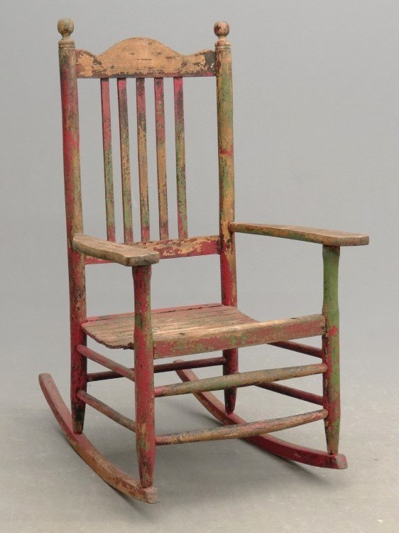 Rocking Chair: Early slat seat porch rocking chair in multicolored paint surface. 43" Ht.