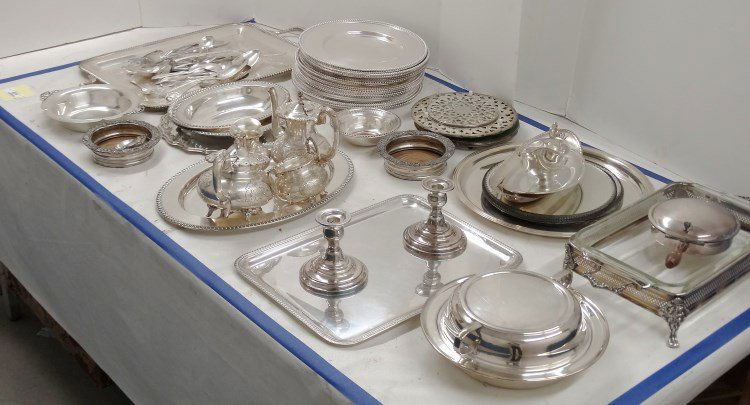 Silverplate Lot: Misc. silverplate lot including wine coasters, plates, dishes, serving pieces (some hallmarked), tea set etc. Property of a Salisbury Connecticut home.