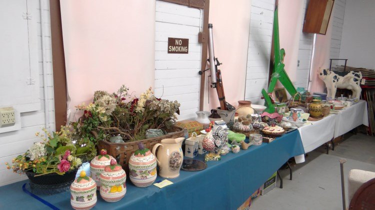Large Table Lot: Large misc. table lot including papier mache cow (as found), telescope, baskets, china, glass, stoneware etc. Over (100) pieces.
