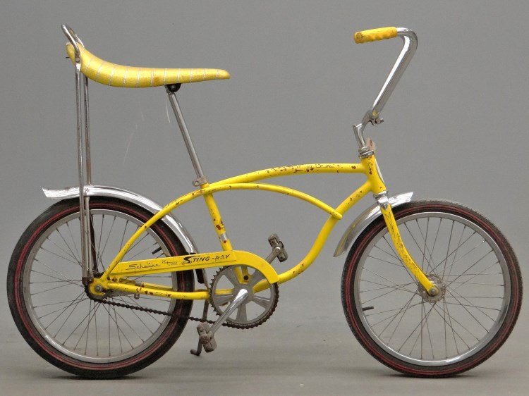 Schwinn Sting Ray Bicycle: C. 1960's Schwinn Sting Ray Deluxe bicycle. After market tires, paint and chrome fair.