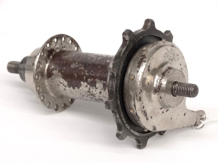 New Departure Hub: Rare New Departure "Controller" hub. Plating lifting, axel threads worn. Information supplied states age as C. 1897 - 1898, considered the first coaster "decelerator" brake hub, designed by New Depart